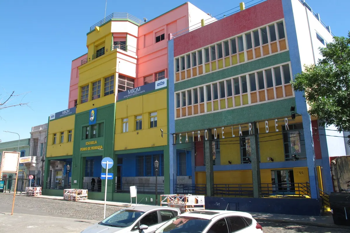 A brightly painted public school building in Buenos Aires